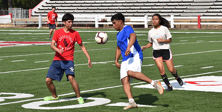 Students playing soccer